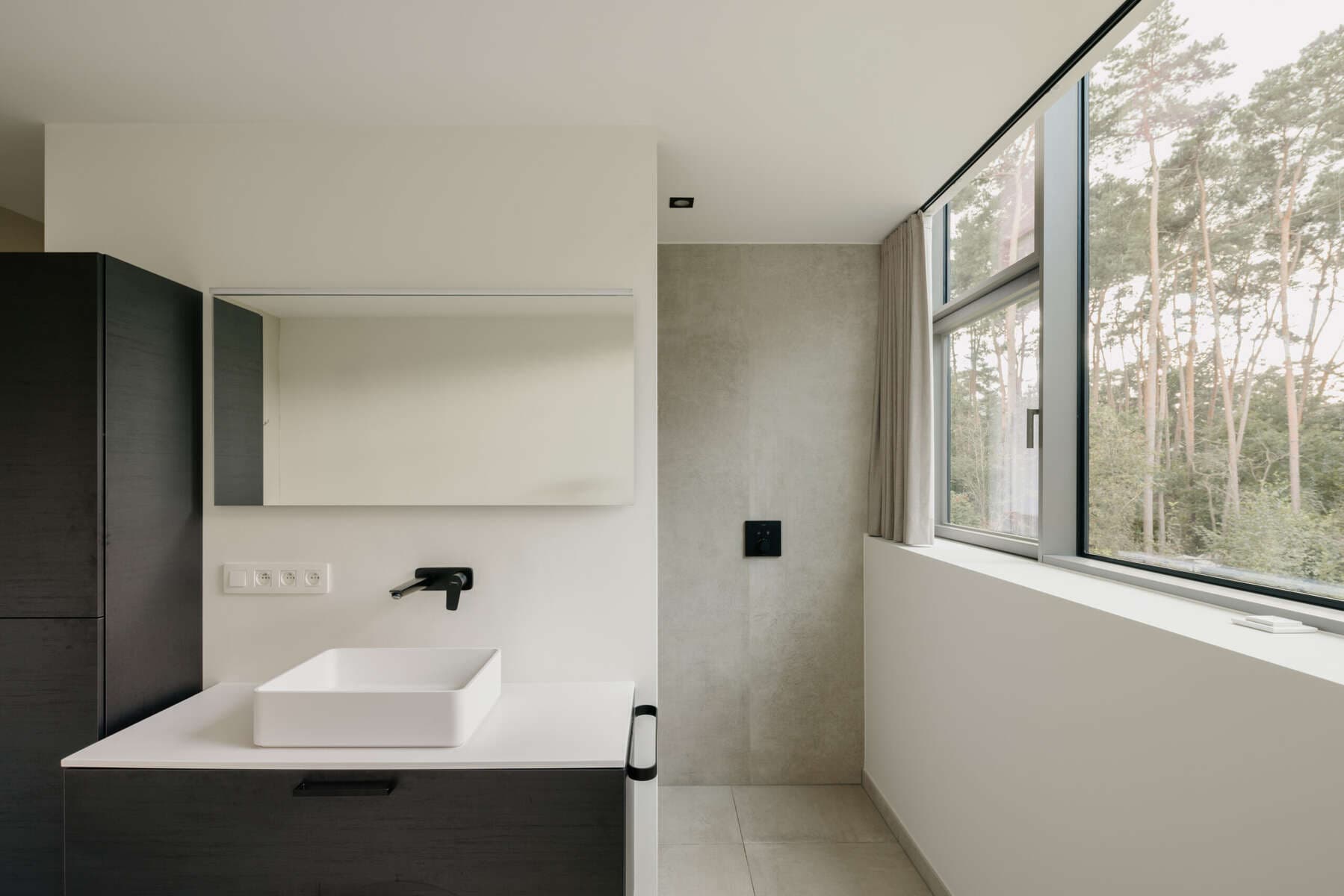 Moisture-resistant stretch ceiling in a modern bathroom
