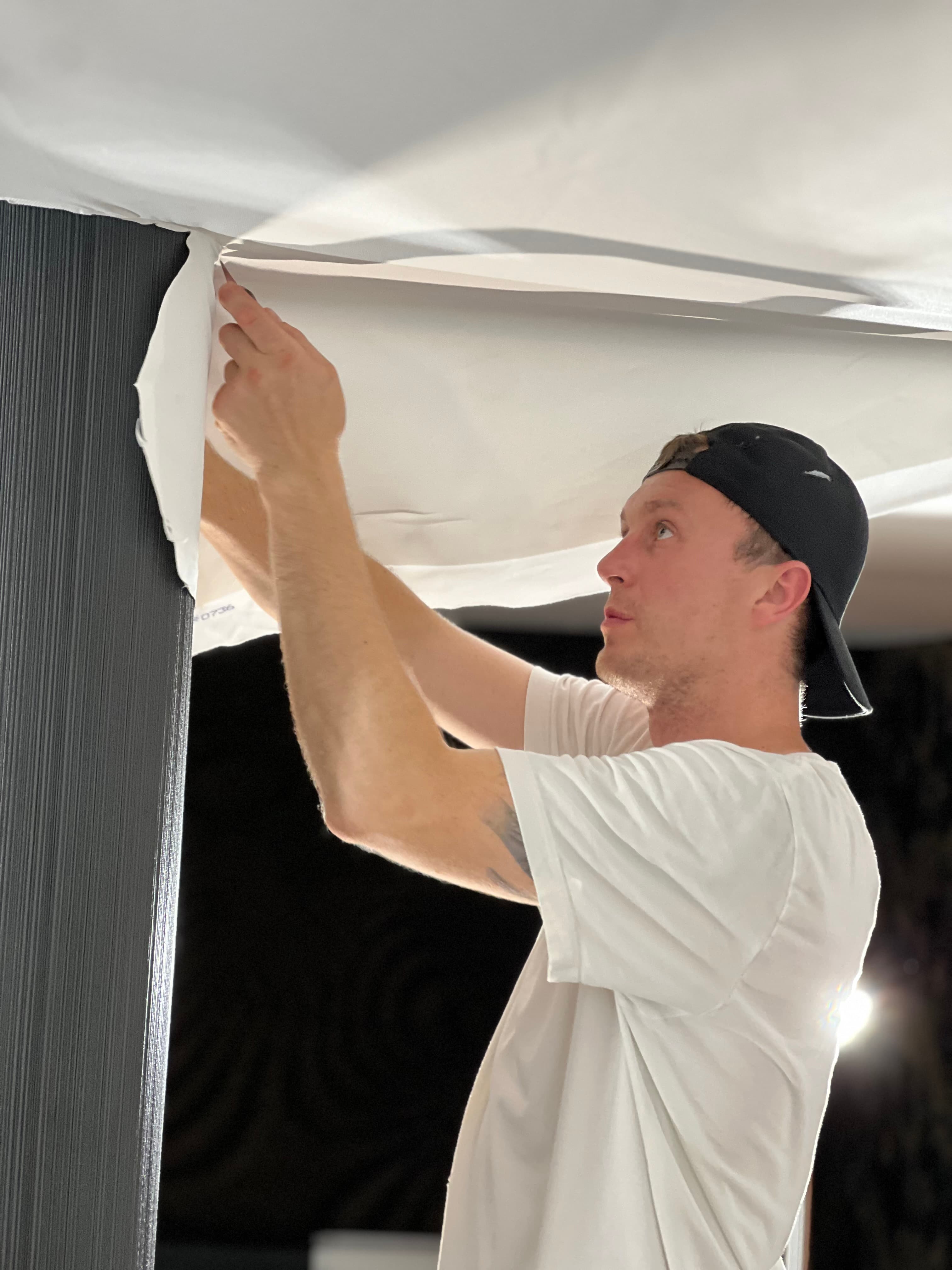 Certified STRETCH installer fitting a stretch ceiling